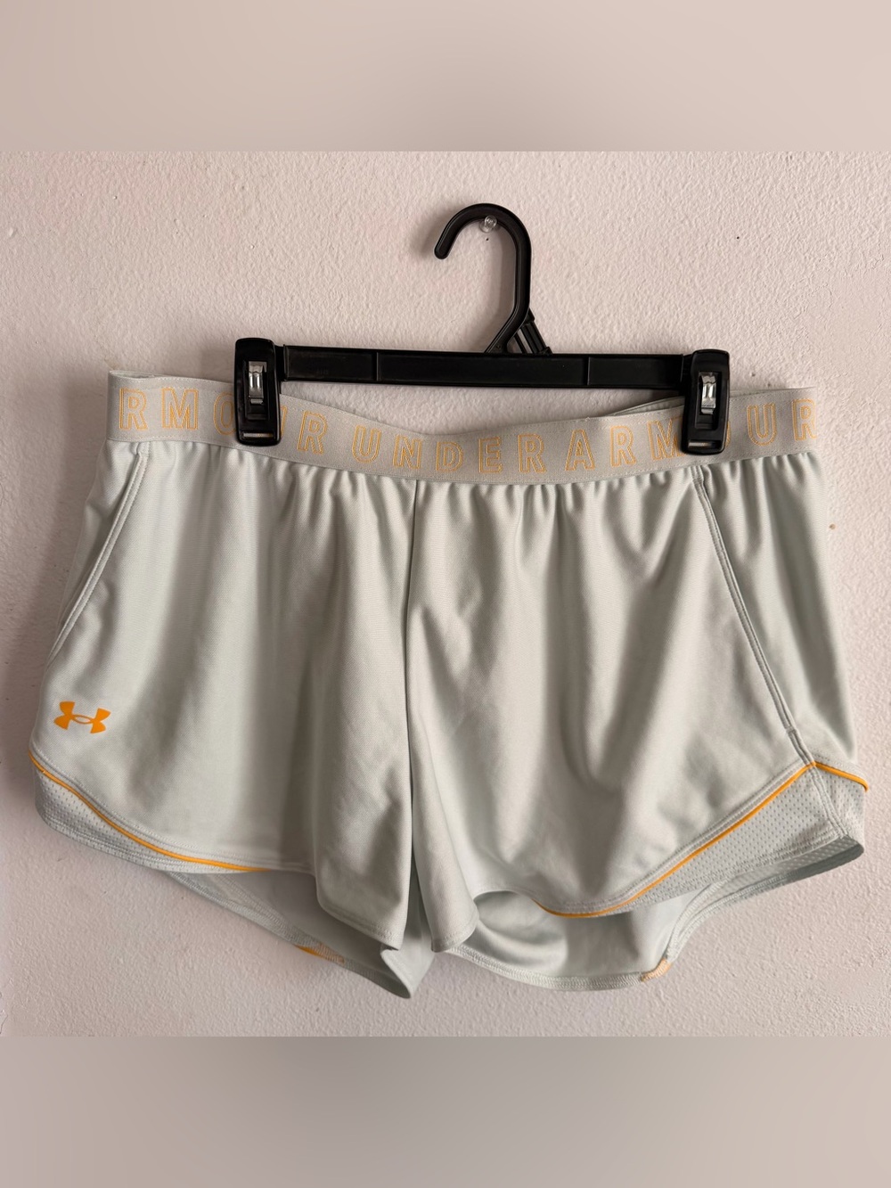 Under Armour Women's Light Gray Athletic Shorts with Yellow Accents